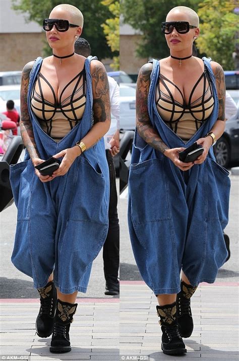 Amber Rose Romps Around Town in Cleavage-Baring Dungarees and Combat ...