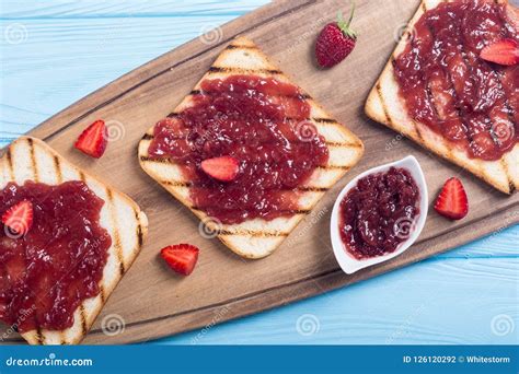 Toast with strawberry jam stock photo. Image of ripe - 126120292