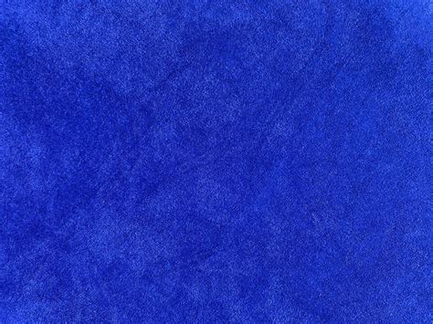 Blue velvet fabric texture used as background. Empty blue fabric ...