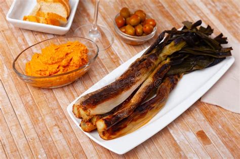 A Traditional Catalan Dish of Charred Calcot Onion and Romesco Sauce ...