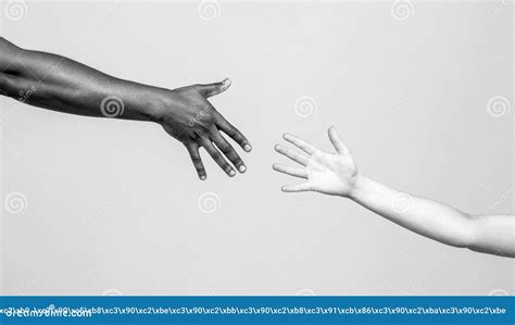 Black and White Human Hands. African and Caucasian Hands. Giving a ...