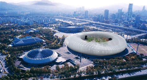 an aerial view of a large building with a giant white object in front of it