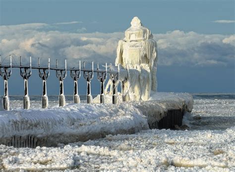 Frozen St Joseph North Pier Lighthouse in St Joseph Michigan Info in ...