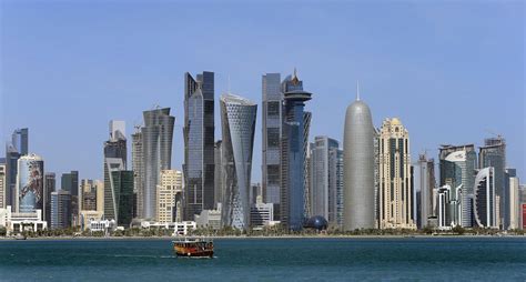 The skyline of Doha's West Bay high rise buildings, in Doha, Qatar ...