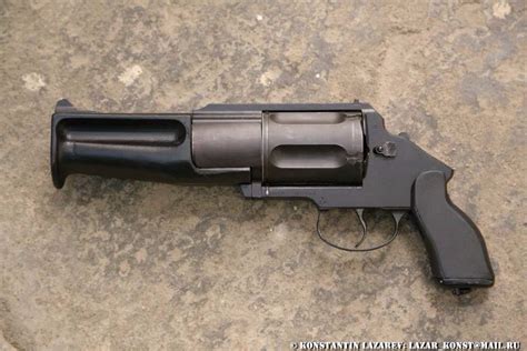 guns etc. (a sawn off MTs-255 revolving shotgun)