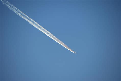 aircraft with vapor trail 6090355 Stock Photo at Vecteezy