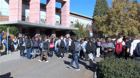 Reno High School students walk out to show support for former coach