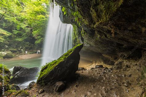 Inside Nabegataki waterfalls in Kumamoto, Kyushu, Japan Stock Photo ...