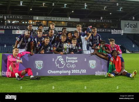 West Bromwich Albion players pose for a team photo with the trophy ...