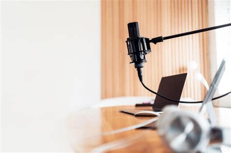 Premium Photo | A microphone in the radio studio and computers on the table