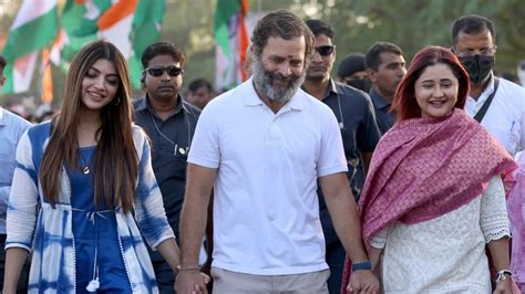 Rahul Gandhi holds Rashami Desai's hand as they walk together during ...