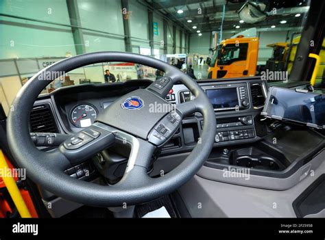 Interior of a new model of a dump truck Scania cabin: seat, wheel ...