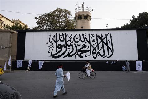 Taliban flag rises over seat of power on fateful anniversary | AP News