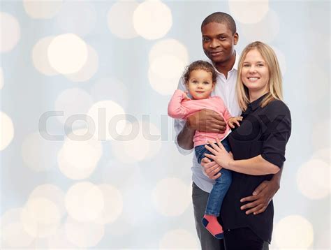 happy multiracial family with little child | Stock image | Colourbox