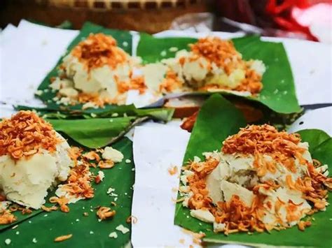 several pieces of food on top of green leaves