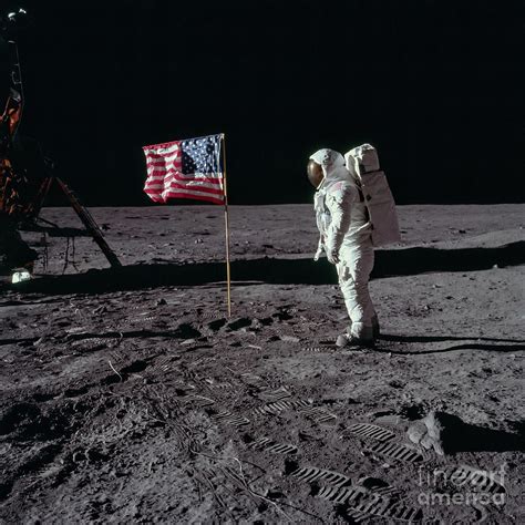 US flag on the moon Photograph by Courtesy of NASA