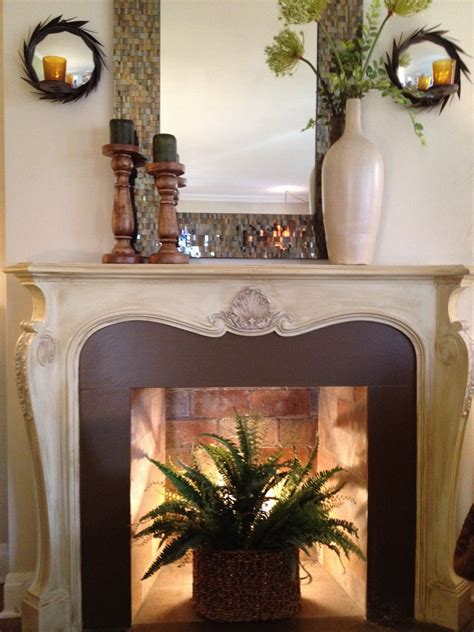 Empty Fireplace Ideas with Mirror and Plant Decor