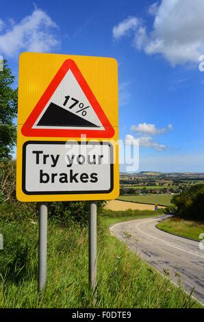 steep road sign with a truck driving down a steep downgrade in black ...