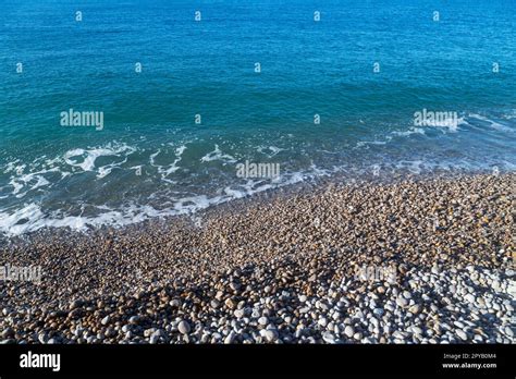 French coastline of Normandy in Etretat, France with pebbles beaches ...