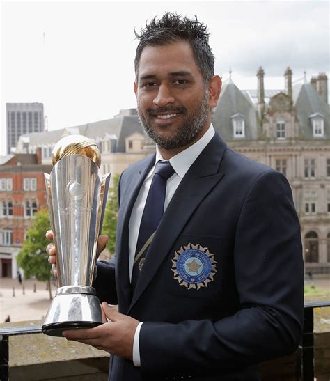 MS Dhoni with the Champions Trophy | ESPNcricinfo.com