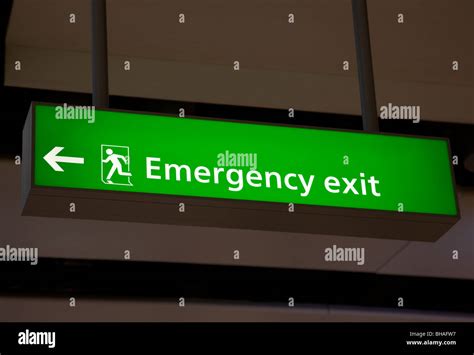 Emergency exit sign at airport, Terminal 5, Heathrow airport, London ...