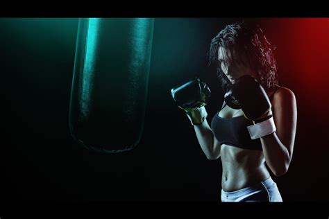 Woman in Boxing Gloves With Sports Bra Posing Boxing Style in Front of ...