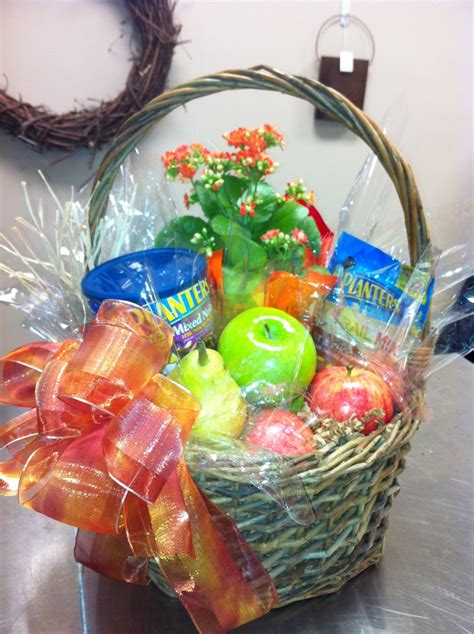 Healthy gift basket of Assorted Nuts, Apples and potted plant | Healthy ...