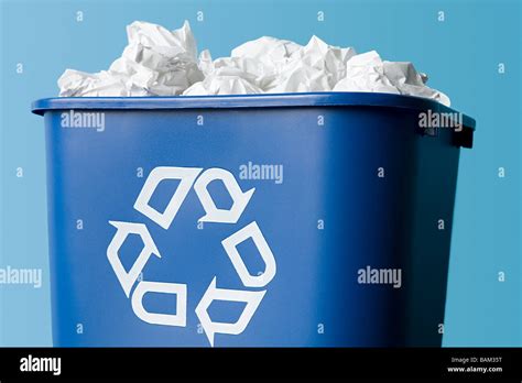 Paper in a recycling bin Stock Photo - Alamy