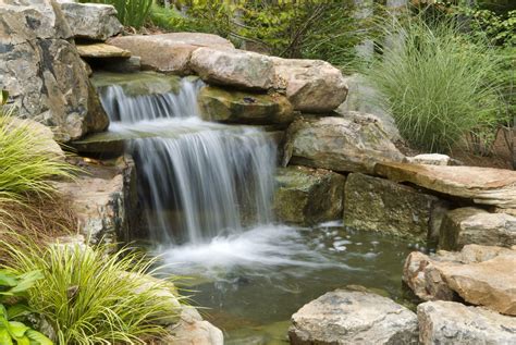 A simple, cheap way to build outdoor waterfalls is to erect cascading ...