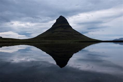 Premium Photo | Reflection of the kirkjufell mountain one of iceland ...