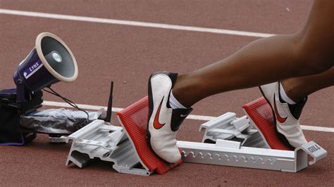 Why are track starting blocks designed to begin from the crouching ...