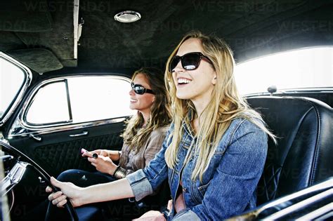 Women driving vintage car stock photo