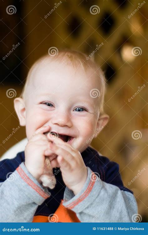 Laughing baby stock photo. Image of bite, laughing, eating - 11631488