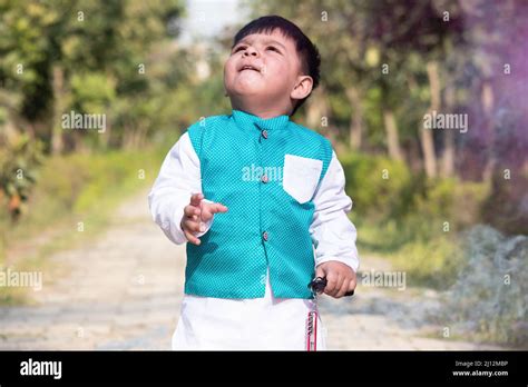 Portrait Of Young Indian Toddler Boy In Ethnic Indian Dress With Funny ...