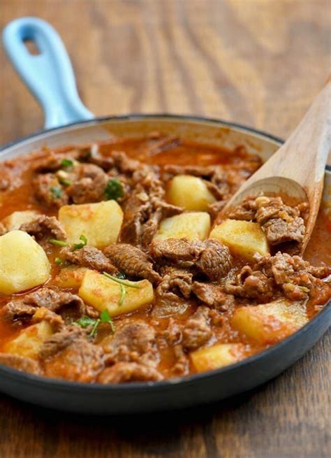 Spicy Carne guisada with potatoes and a hearty tomato sauce. This ...