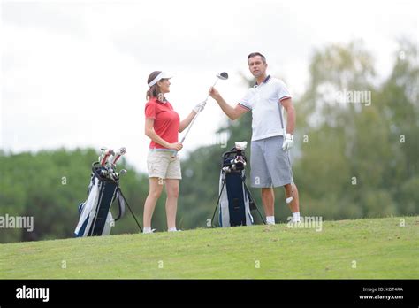 friends doing golf Stock Photo - Alamy