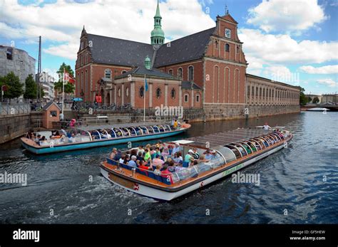 The new sustainable electric canal tour boat passing a Netto diesel ...