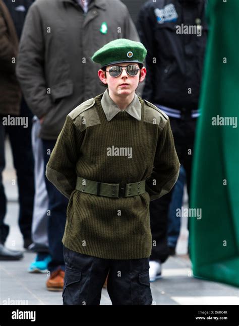 A youth from dissident group Republican Sinn Fein parades in ...