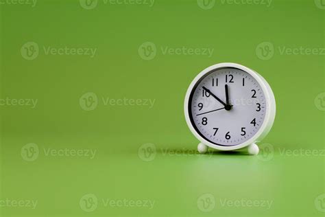 Alarm clock on green background, time concept, clock photo 19761566 ...