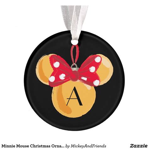 a mickey mouse ornament with a red bow on it's head and the letter a