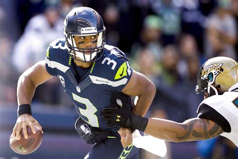 Russell Wilson is the third-highest paid quarterback on the Seattle ...