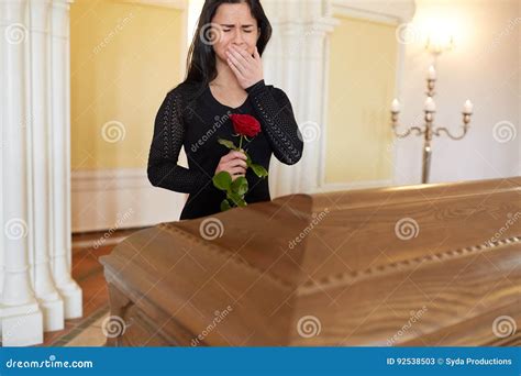 Crying Woman with Red Rose and Coffin at Funeral Stock Image - Image of ...