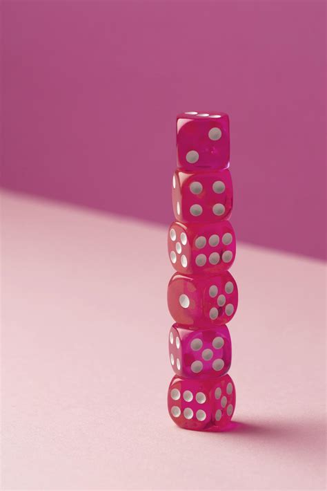 Stacked pink dice on pink background 2410799 Stock Photo at Vecteezy