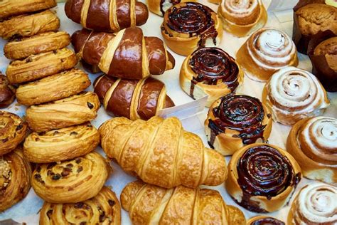 Premium Photo | Fresh baked pastries close-up on a bakery showcase.