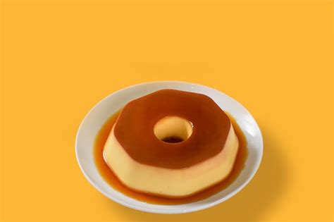 Premium Photo | A plate of flan with caramel sauce on it