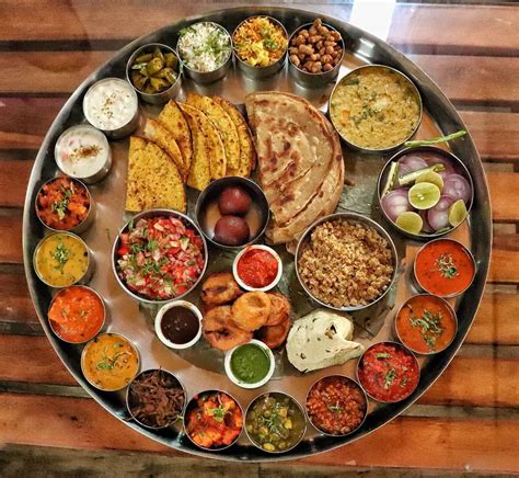 This enormous thali includes more than 25 dishes apart from the two ...