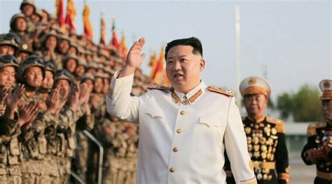 Kim Jong Un celebrates successful military parade with dozens of group ...