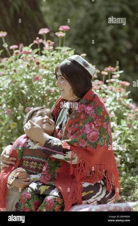 Tajik mother and child happy in their garden Stock Photo - Alamy