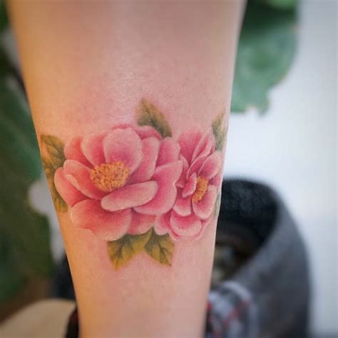 Watercolor camellia tattoo by tattooist G.NO - Tattoogrid.net