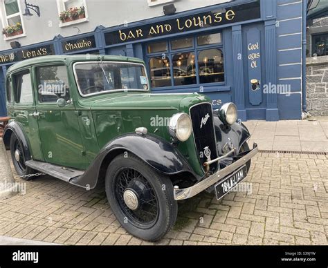 An Austin 10 motor car parked outside a bar In Adare,Limerick,Ireland ...